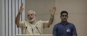 Indian Prime Minister Narendra Modi delivers the inaugural speech during an event to mark the national Panchayati Raj or village civil council day, in New Delhi, India, Friday, April 24, 2015. Modi on Friday urged Panchayat members to work with a five-year vision with concrete development plans to bring about positive changes in their village and also emphasized on the need for education, according to local reports. (AP Photo/Manish Swarup)