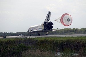 With the aid of a drogue chute, space shuttle Discovery slows to a stop on Runway 15 at NASA's Kennedy Space Center in Florida to complete the 13-day, 5.3-million mile journey to the International Space Station. Discovery delivered the final pair of power-generating solar arrays and the S6 truss segment. Image Credit: NASA/Kevin O'Connell